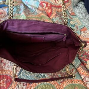 Burgundy coach purse.